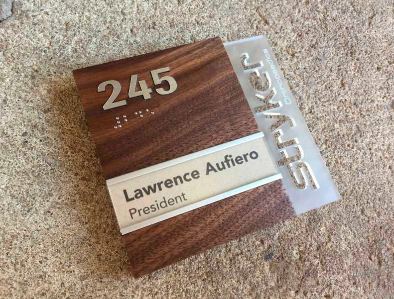 Creative ADA Nameplate in walnut and metal laser cut logo